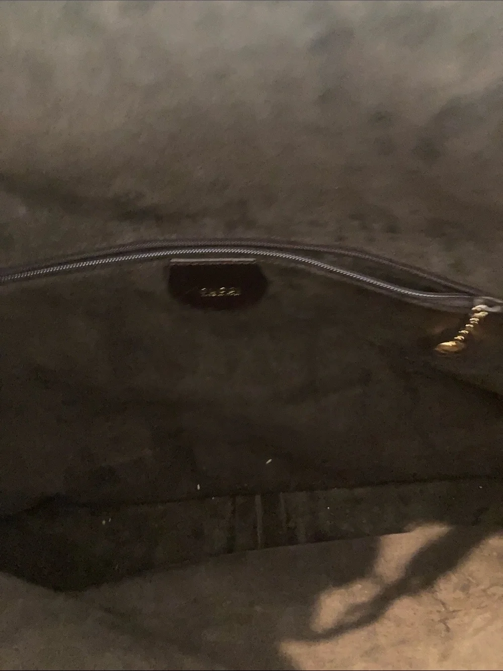 Brown leather/Suede interiorHandbag Interior with Zip Pocket. Dust bag included.